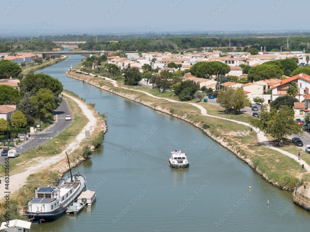 Aigues-Mortes France. The port city of Aigues-Mortes. Yachts moored off the coast. The maritime channel flows into the Mediterranean Sea. The concept of historical and photographic tourism