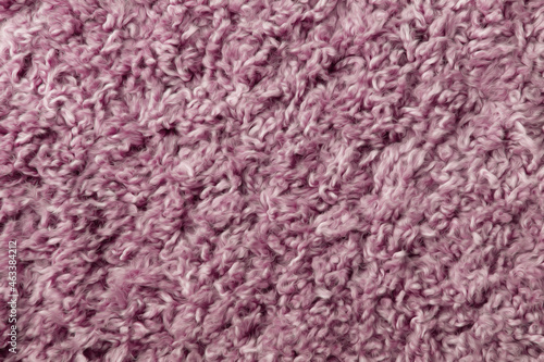 Abstract texture of the surface of a pink carpet