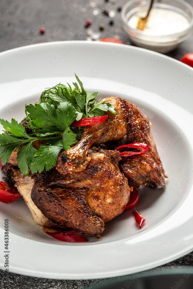 Grilled BBQ crispy chicken legs quarter with tamarind sauce and with chili peppers and herbs, Healthy fats, clean eating for weight loss
