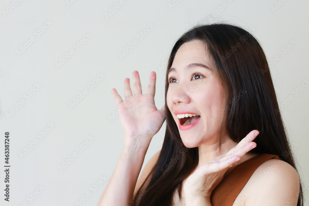 Surprised Asian women with white background and space for promotion advertisement and text Surprised Asian women with white background and space for promotion advertisement and text