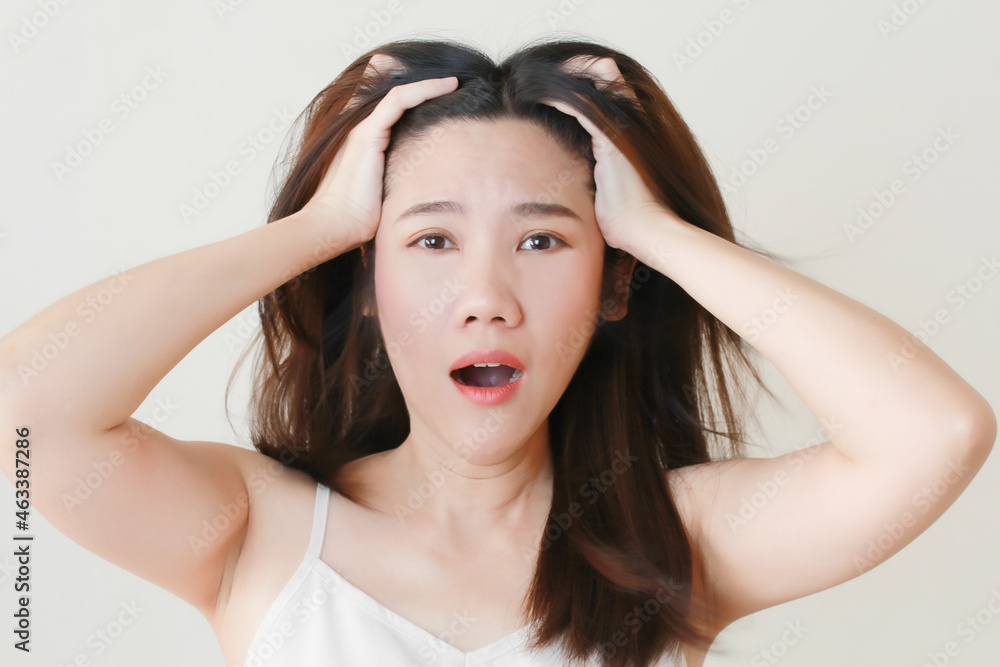Asian  women shocked afraid and surprise face touch her head