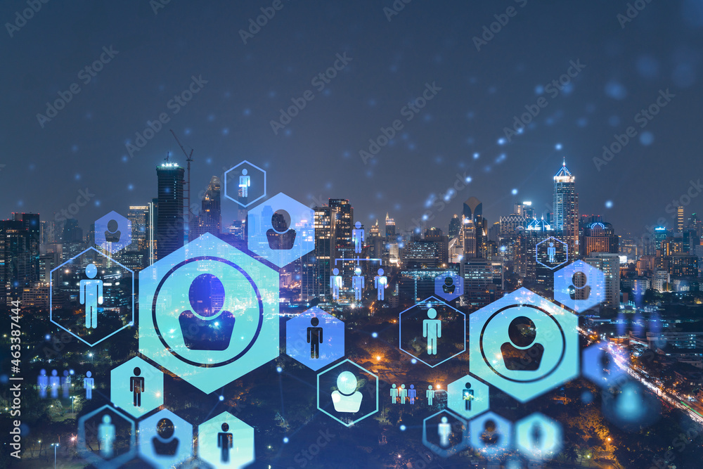 Fototapeta premium Glowing social media icons on night panoramic city view of Bangkok, Southeast Asia. The concept of networking and establishing new connections between people in businesses. Double exposure.