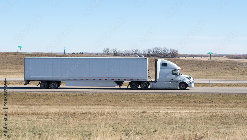 Heavy Cargo on the Road. A truck hauling freight along a highway