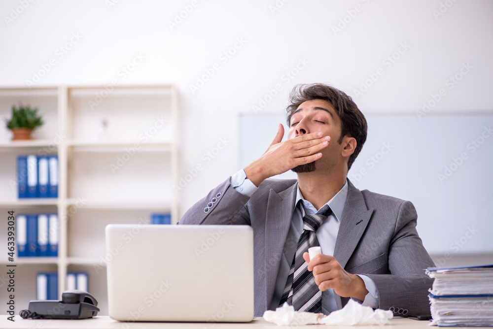 Young businessman employee suffering at workplace Young businessman employee suffering at workplace