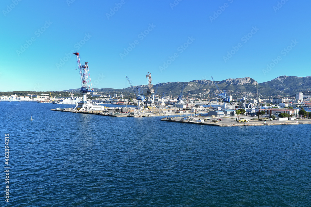 View of the military port of the city of Toulon with its cranes.