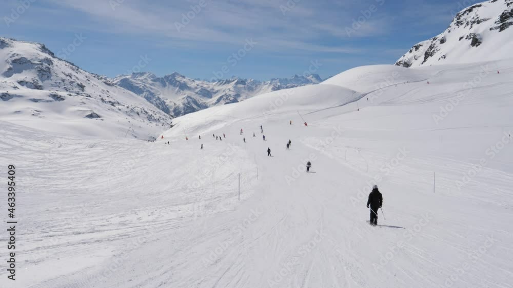 A Lot Of Skiers Roll Down The Snowy Ski Track In Winter In The Mountains A Lot Of Skiers Roll Down The Snowy Ski Track In Winter In The Mountains