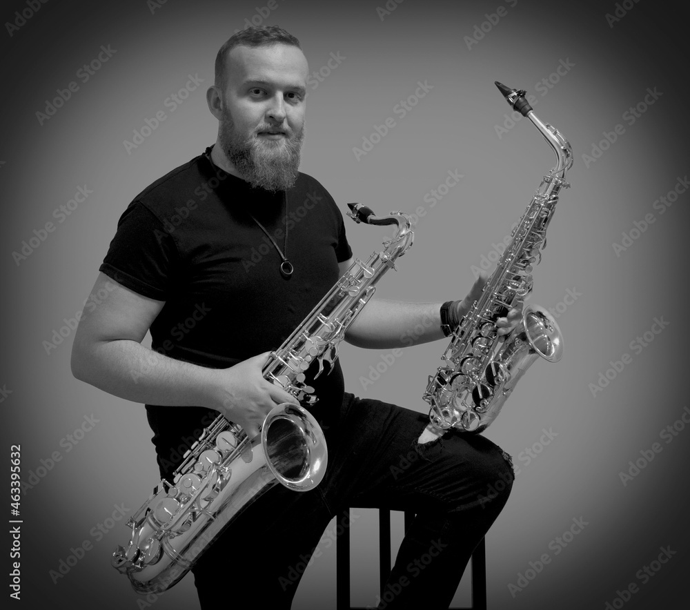 Obraz premium Portrait of a man with a saxophone