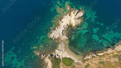Aerial drone photo of tropical exotic paradise rocky bay with deep turquoise sea forming a blue lagoon © aerial-drone