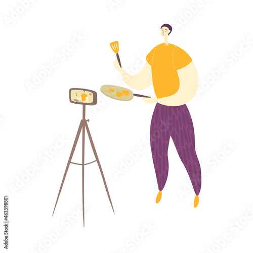 Man is holding frying pan and kitchen spatula in his hands. Cook kitchener is standing in front of camera and filming video. Flat cartoon character