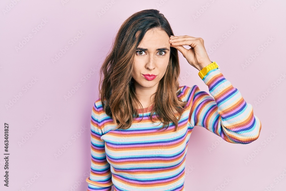 Young hispanic girl wearing casual clothes worried and stressed about a problem with hand on forehead, nervous and anxious for crisis Young hispanic girl wearing casual clothes worried and stressed about a problem with hand on forehead, nervous and anxious for crisis