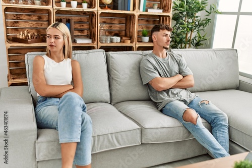 Young caucasian couple smiling happy at home.