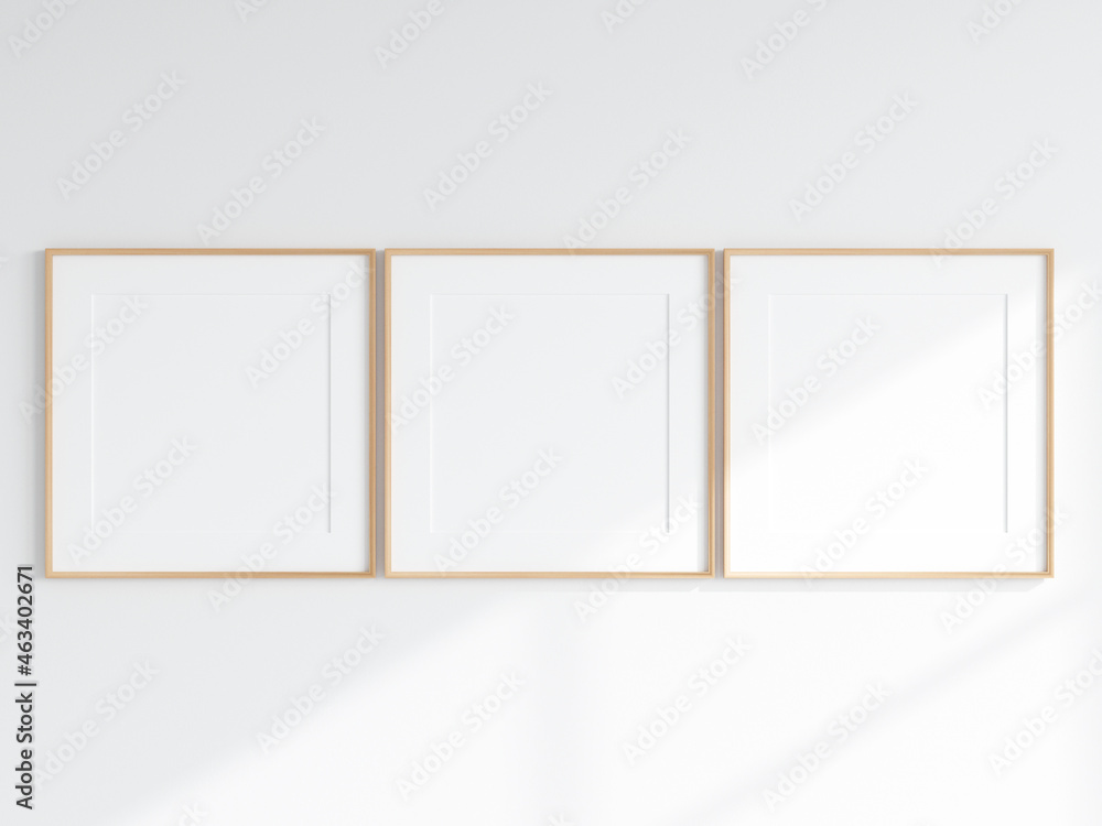 poster frame mockup, three square wooden frames with matt on the wall, 3d render poster frame mockup, three square wooden frames with matt on the wall, 3d render
