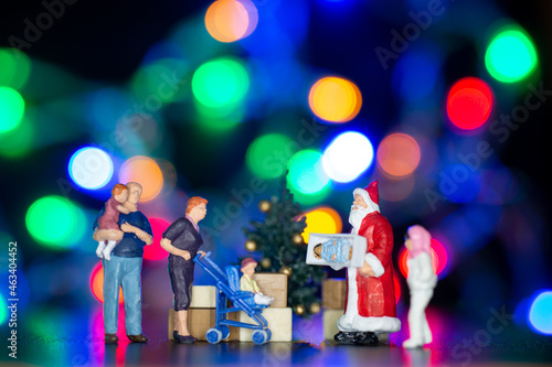 Miniature people, Santa claus delivery gift box to kids ,Christmas and Happy New Year concept.