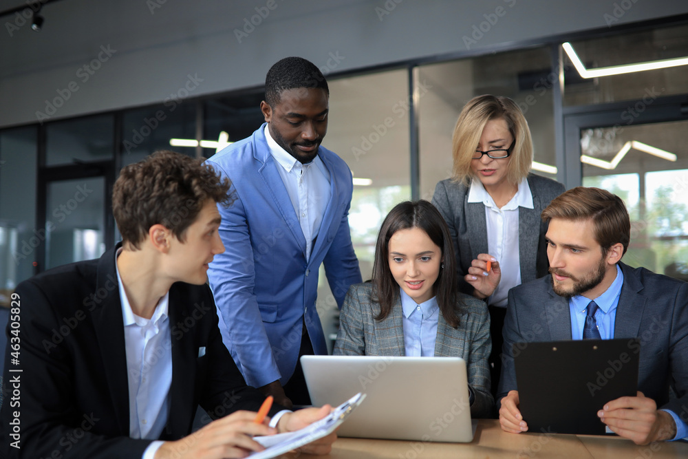 Startup business team on meeting in modern bright office interior and working on laptop. Startup business team on meeting in modern bright office interior and working on laptop.