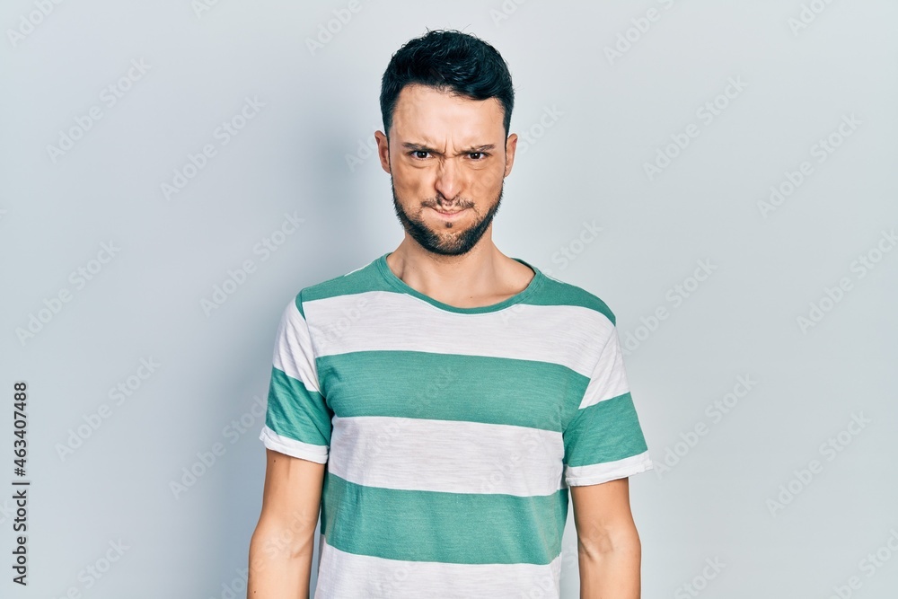 custom made wallpaper toronto digitalYoung hispanic man wearing casual clothes puffing cheeks with funny face. mouth inflated with air, crazy expression.