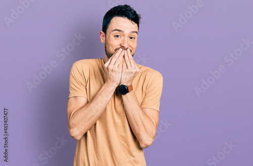 Fotografie Hispanic man with beard wearing casual t shirt laughing and embarrassed giggle c