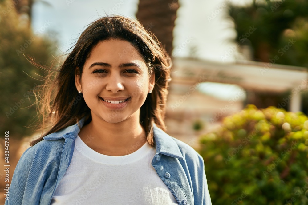 Young latin girl smiling happy standing at the city. Young latin girl smiling happy standing at the city.