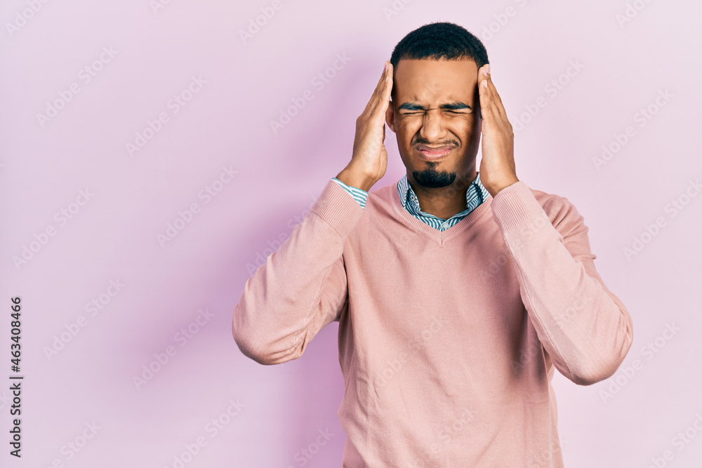 Fototapeta premium Young african american man wearing elegant clothes suffering from headache desperate and stressed because pain and migraine. hands on head.