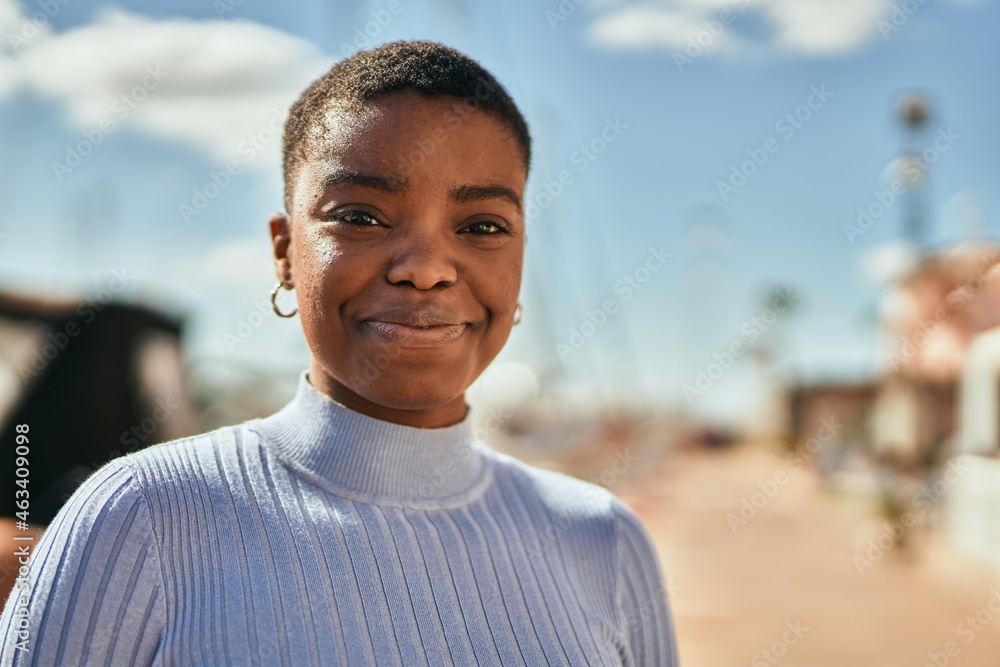 Young african american woman smiling happy standing at the port. Young african american woman smiling happy standing at the port.