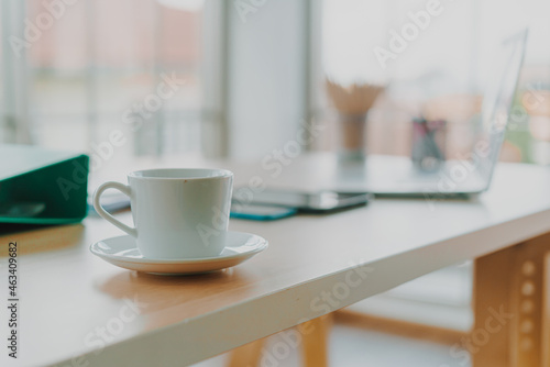 white coffee cup on working table
