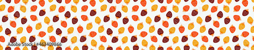 Seamless pattern with yellow, orange and brown strawberries.