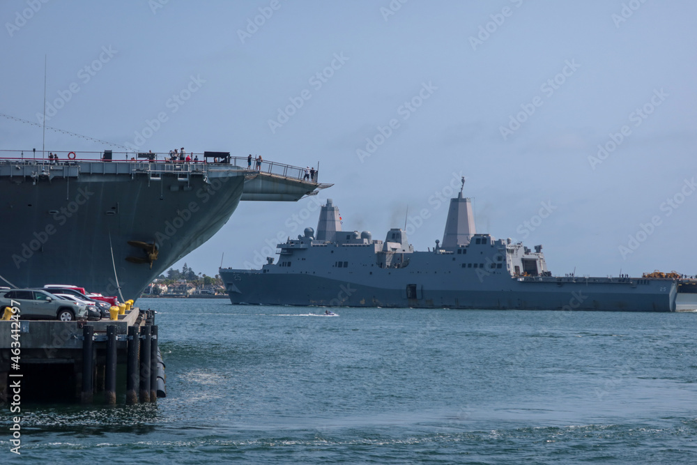 A Navy Guised Missile Cruiser Frigate Departing San Diego, California, Coronado Bay Near the USS Midway A Navy Guised Missile Cruiser Frigate Departing San Diego, California, Coronado Bay Near the USS Midway