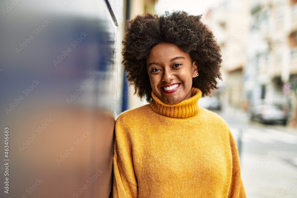Young african american girl smiling happy standing at the city. Young african american girl smiling happy standing at the city.