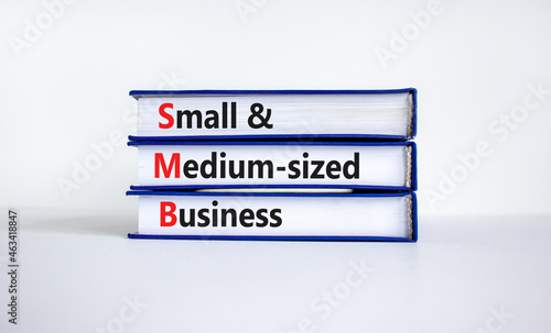 SMB small and medium-sized business symbol. Words SMB small and medium-sized business on books on a beautiful white background. Business and SMB small and medium-sized business concept. Copy space.