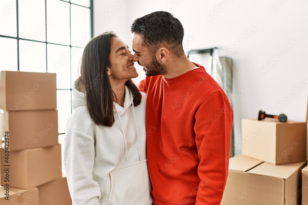 Young latin couple smiling happy standing at new home. Young latin couple smiling happy standing at new home.