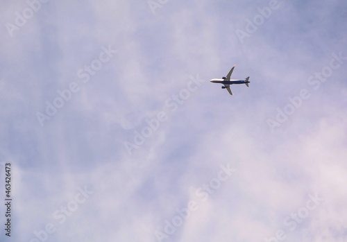 Passenger plane in the cloudy sky