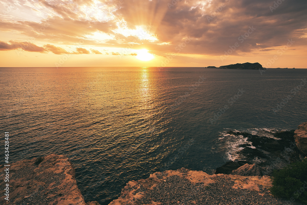 Beautiful sunset with a dramatic sky and clouds over the sea Beautiful sunset with a dramatic sky and clouds over the sea