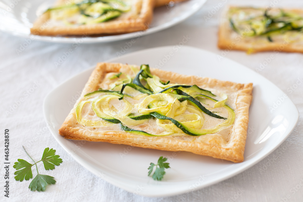 Pizza with zucchini and vegetable cheese. Vegan appetizer