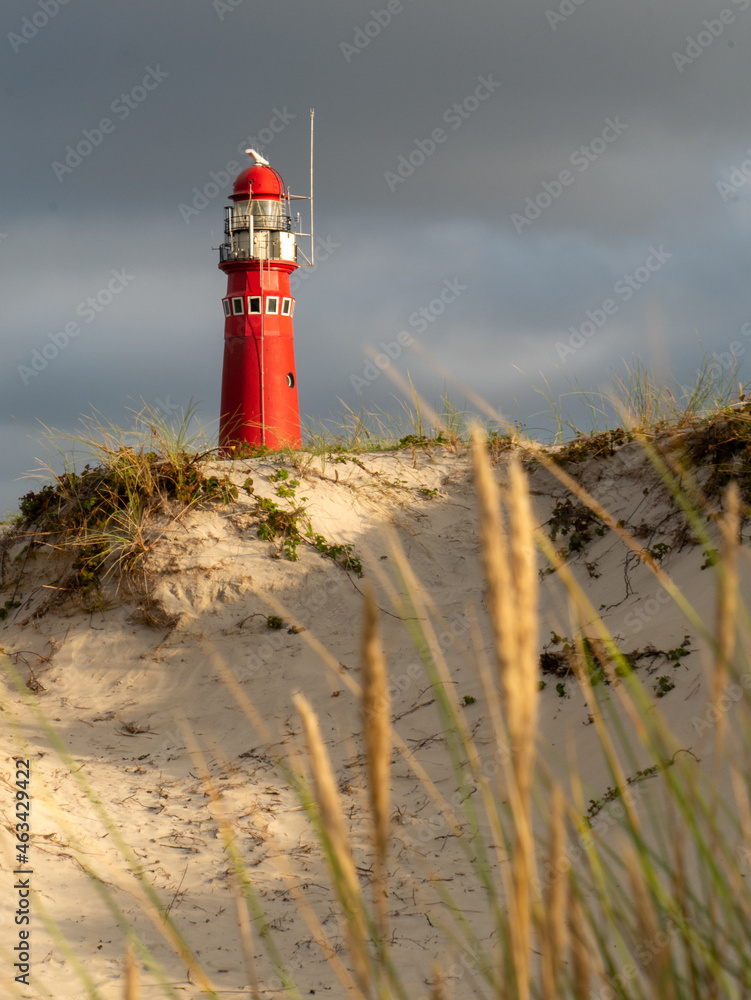 Red Lighthouse at Schiermonnikoog. Noordertoren. with beautiful scenery, lights and heavy sky in the dunes
Red Lighthouse at Schiermonnikoog. Noordertoren. with beautiful scenery, lights and heavy sky in the dunes