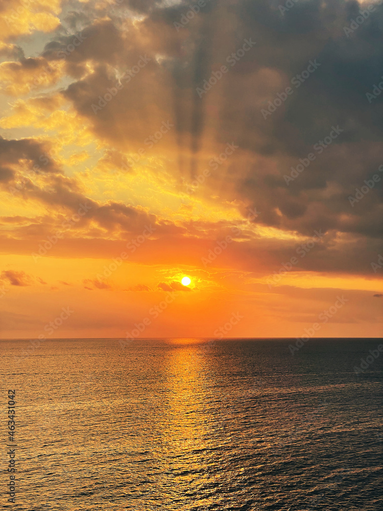 Fototapeta premium Beautiful sunset with a dramatic sky and clouds over the sea