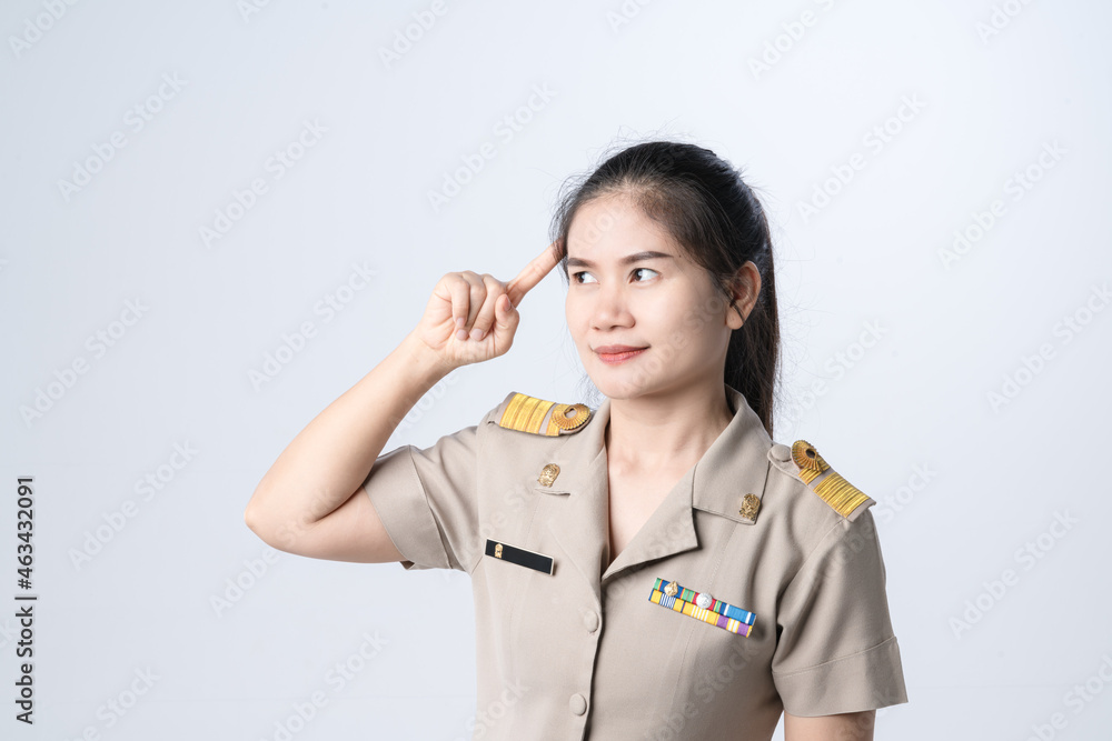 Thai teachers in official uniform with thinking gesture Thai teachers in official uniform with thinking gesture