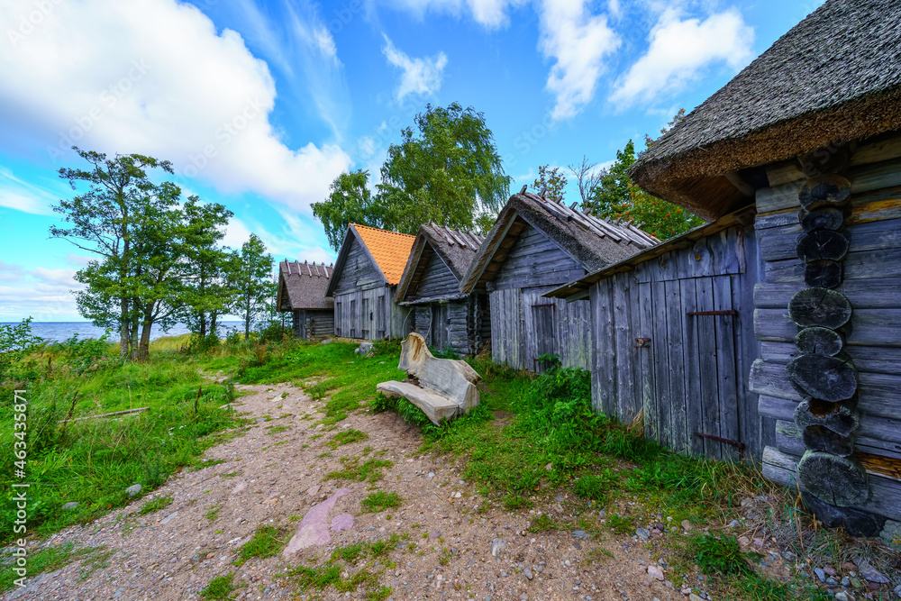Old wooden cabins in a fishing village by the sea. Estonia. Old wooden cabins in a fishing village by the sea. Estonia.
