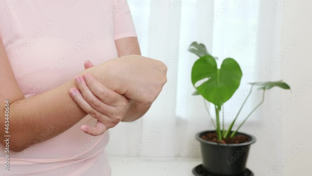 Women doing hands stretching and exercising to protect office syndrome and hand arthritis after work at home office day. Health care easy self massage concept. Women doing hands stretching and exercising to protect office syndrome and hand arthritis after work at home office day. Health care easy self massage concept.