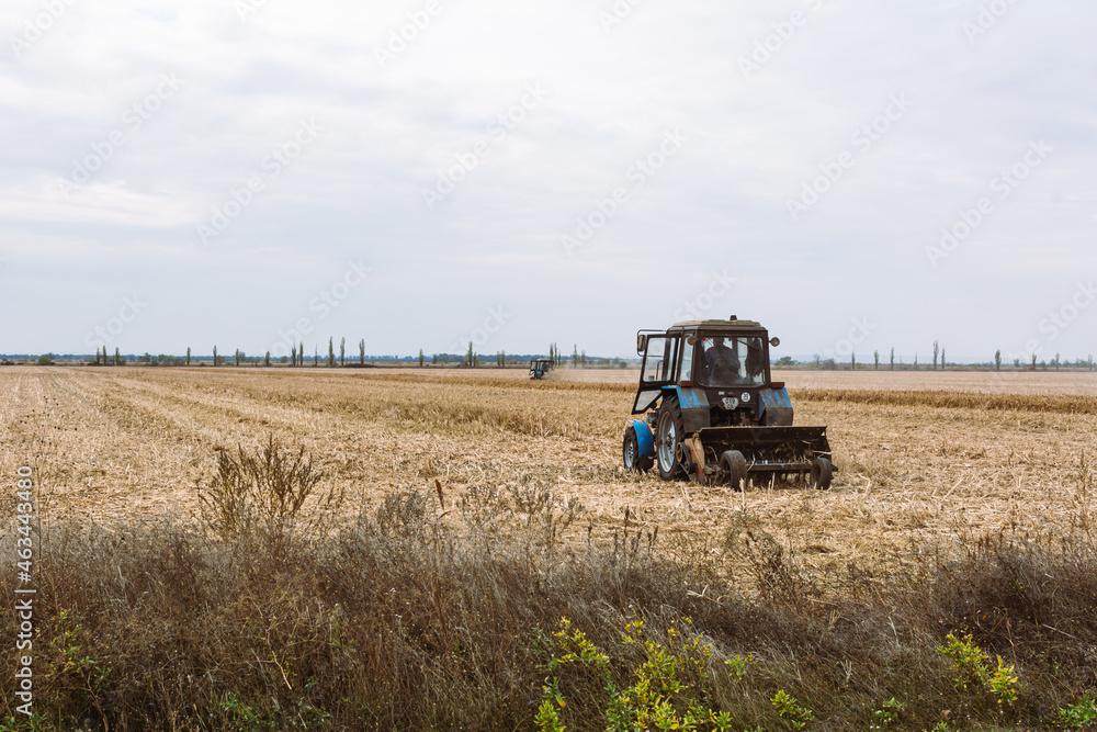 Combine harvesting corn trash of cobs, stover, stalks and debris. Combine harvesting corn trash of cobs, stover, stalks and debris.