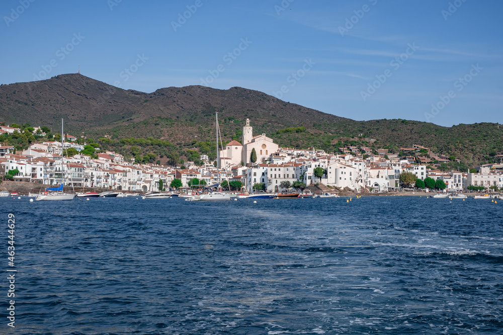 View of Cadaques with the church bell and white houses from a boat, Catalonia, Spain