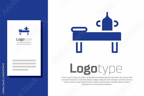 Blue Massage table with oil icon isolated on white background. Logo design template element. Vector