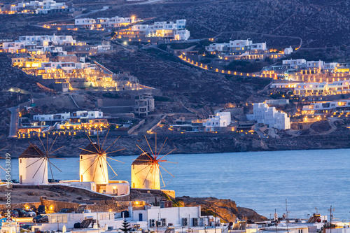 Iconic picture of Mykonos. Famous windmills of Mykonos Island, Greece. Sunset time