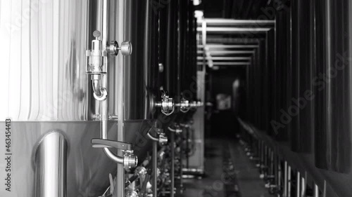 Private microbrewery. Modern beer plant with brewering kettles, tubes and tanks made of stainless steel photo