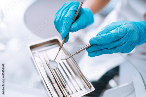 A set of sterile dental instruments for dental treatment. Dental care for people.