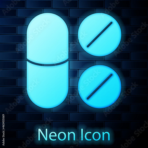 Glowing neon Toothache painkiller tablet icon isolated on brick wall background. Tooth care medicine. Capsule pill and drug. Pharmacy design. Vector