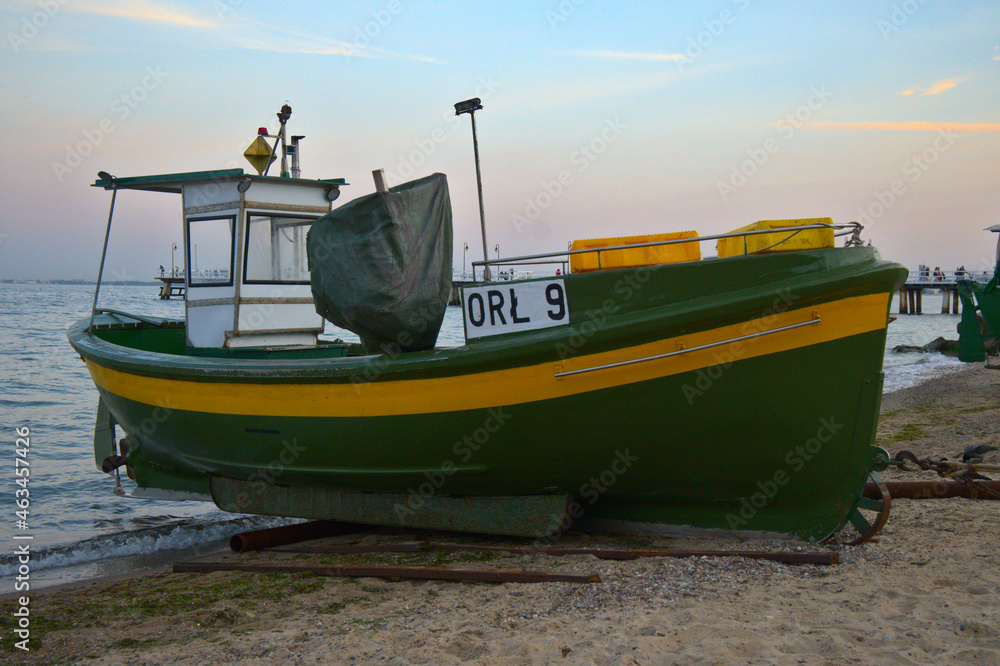 Fishing boat on a beach sand. OR 9 in Gdynia Fishing boat on a beach sand. OR 9 in Gdynia