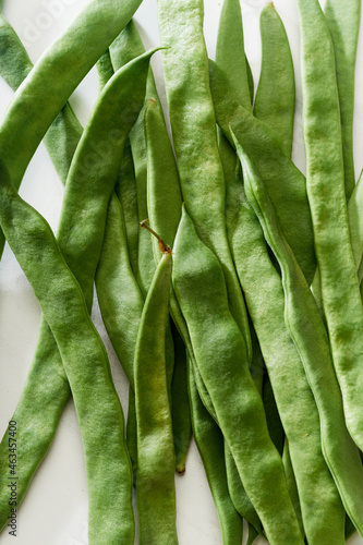 Flat lay green beans white background