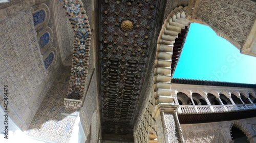 Seville, Spain, September 12, 2021: DOLLY SHOT SLOW MOTION - The Royal Palace of Seville (Real Alcazar). The Maidens Courtyard ceiling details.
