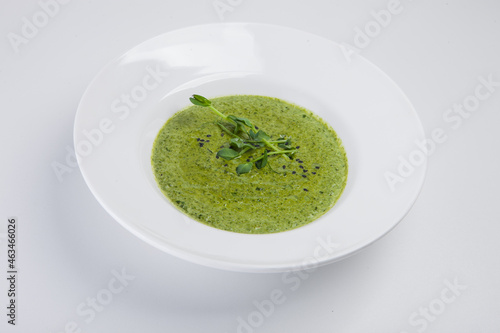 soup cream, spinach, white plate