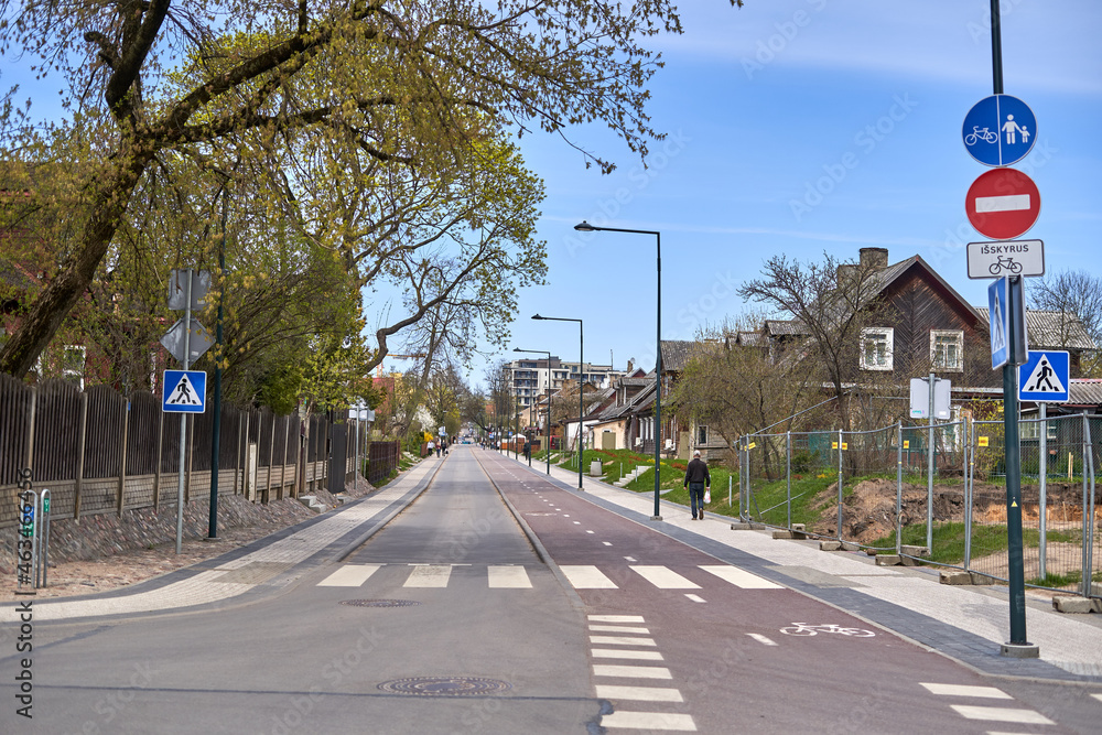 One direction street with do not enter sign. Bicycle lane on the right. 