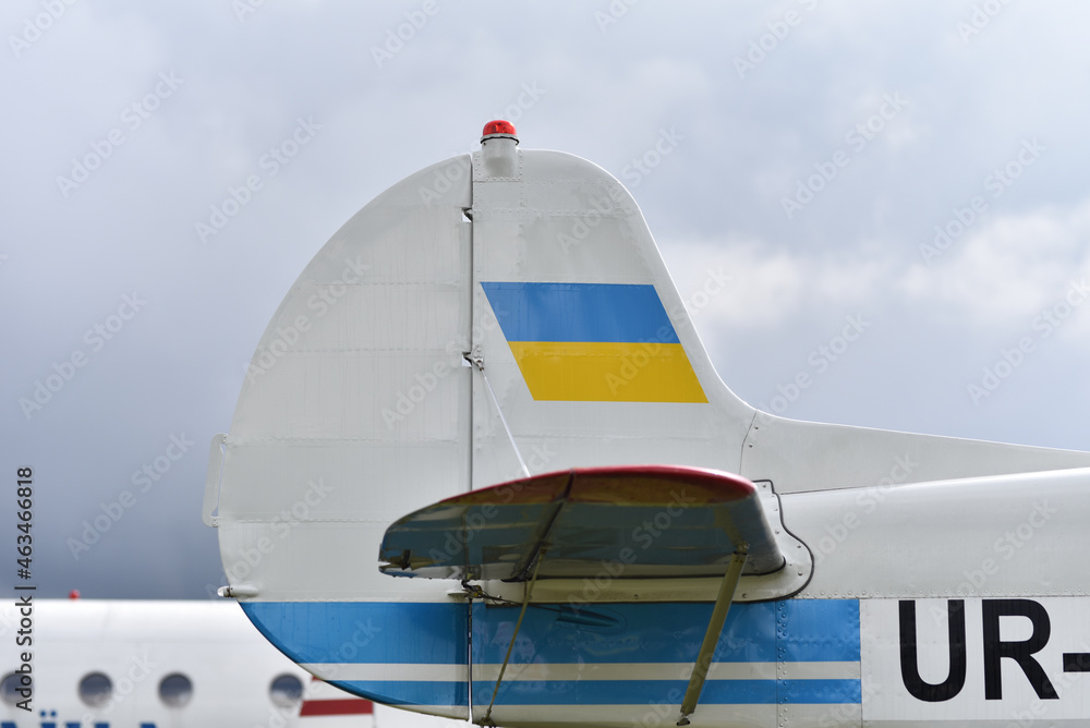 tail of short-haul passenger airplane with ukrainian flag in airport tail of short-haul passenger airplane with ukrainian flag in airport